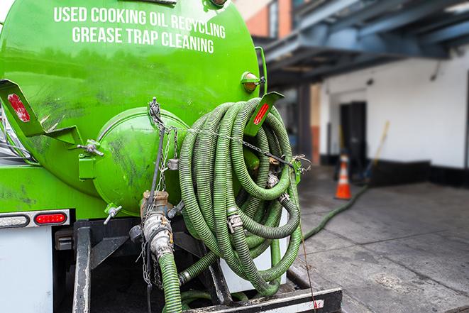 a service truck pumping grease from a restaurant's grease trap in Waverly, PA